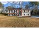 Charming two-story home with a well-manicured lawn and traditional design at 2390 Amberbrook Sw Dr, Conyers, GA 30094