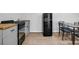 Basement kitchenette with retro refrigerator and functional cooking area at 2390 Amberbrook Sw Dr, Conyers, GA 30094