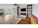 Bright living room featuring an electric fireplace, built-in shelves, and a cozy seating area, perfect for relaxation at 2390 Amberbrook Sw Dr, Conyers, GA 30094