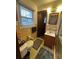 Modest bathroom with a patterned rug, toilet, and a vanity with a sink and wood-finished cabinet at 4164 W Shore Ct, Douglasville, GA 30135