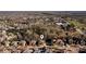 An aerial view of a neighborhood showcases tree coverage and beautiful homes at 5230 Harris Springs Dr, Cumming, GA 30040