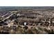 An aerial view shows the surrounding area, with beautiful homes and lots of trees at 5230 Harris Springs Dr, Cumming, GA 30040