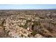 Aerial image of a neighborhood with well-maintained lawns and mature trees in the area at 5230 Harris Springs Dr, Cumming, GA 30040