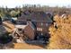 Spacious backyard with a patio, stairs and deck for outdoor entertaining and relaxation at 5230 Harris Springs Dr, Cumming, GA 30040