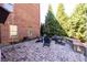 Well-maintained backyard patio with stone pavers, a fire pit, and outdoor seating for relaxing and entertaining at 5230 Harris Springs Dr, Cumming, GA 30040