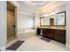 Elegant bathroom featuring a separate shower and a soaking tub beneath a tray ceiling at 5230 Harris Springs Dr, Cumming, GA 30040