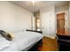 Cozy bedroom featuring hardwood floors, neutral tones, and ample natural light at 5230 Harris Springs Dr, Cumming, GA 30040