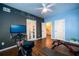Versatile bedroom with chalkboard wall, hardwood floors, and unique access to other rooms at 5230 Harris Springs Dr, Cumming, GA 30040