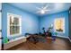 Bright bedroom with hardwood floors and great light, perfect for a home gym with exercise equipment at 5230 Harris Springs Dr, Cumming, GA 30040