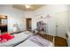 Bright ' bedroom with twin beds, hardwood floors, and a view to an adjacent bathroom at 5230 Harris Springs Dr, Cumming, GA 30040