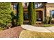 Inviting front entrance with double doors, manicured landscaping, and a covered porch at 5230 Harris Springs Dr, Cumming, GA 30040