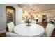 Bright, white kitchen features a breakfast area and walk-in pantry for convenient storage at 5230 Harris Springs Dr, Cumming, GA 30040