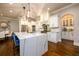 Bright kitchen with quartz island, stainless steel appliances, and ample cabinet space at 5230 Harris Springs Dr, Cumming, GA 30040