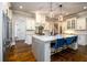 Well-appointed kitchen featuring a large center island with bar seating and stainless steel appliances at 5230 Harris Springs Dr, Cumming, GA 30040