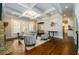 Sitting room featuring a fireplace, coffered ceilings, and elegant furnishings at 5230 Harris Springs Dr, Cumming, GA 30040