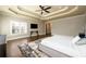 Well-lit main bedroom features hardwood floors, ample natural light, and designer touches at 5230 Harris Springs Dr, Cumming, GA 30040