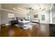 Spacious main bedroom featuring hardwood floors, a tray ceiling, and designer decor at 5230 Harris Springs Dr, Cumming, GA 30040