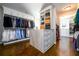 Organized walk-in closet with custom shelving, drawers, and ample storage space at 5230 Harris Springs Dr, Cumming, GA 30040