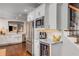 Elegant kitchen with stainless steel refrigerator, marble countertops, and stainless microwave at 12065 Wexford Club Dr, Roswell, GA 30075