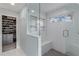 Bathroom showcasing walk-in shower, subway tile, glass, shower seat and closet at 12065 Wexford Club Dr, Roswell, GA 30075