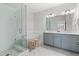 Modern bathroom features a glass shower, soaking tub, and double vanity at 2740 Bell Se Dr, Smyrna, GA 30080