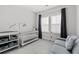 Charming Bedroom with a crib, sofa, and a bright window at 2740 Bell Se Dr, Smyrna, GA 30080