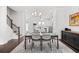 Open floor plan shows dining room leading into kitchen and living space with a staircase at 2740 Bell Se Dr, Smyrna, GA 30080