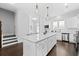Well-equipped kitchen with an island, stainless steel appliances, and seamless transition to the dining area at 2740 Bell Se Dr, Smyrna, GA 30080