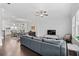 Open floor plan with kitchen and dining room, hardwood floors, comfy seating, and a ceiling fan at 2740 Bell Se Dr, Smyrna, GA 30080