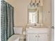 Bathroom featuring vanity and shower with polka dot curtain at 4213 Bretdale Nw Run, Kennesaw, GA 30152