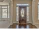 Charming front entryway featuring a decorative wood door and sidelight windows at 4213 Bretdale Nw Run, Kennesaw, GA 30152