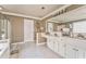 Bright main bathroom featuring dual sinks, a large mirror, and a separate shower at 4213 Bretdale Nw Run, Kennesaw, GA 30152