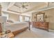 Spacious main bedroom featuring a trey ceiling, ceiling fan, dresser and sitting area at 4213 Bretdale Nw Run, Kennesaw, GA 30152