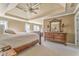 Spacious main bedroom featuring a trey ceiling, ceiling fan, dresser and sitting area at 4213 Bretdale Nw Run, Kennesaw, GA 30152