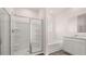 Bathroom showcasing a glass enclosed shower and a soaking tub at 604 Kimberwick Dr, Locust Grove, GA 30248