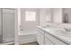 Bathroom featuring double sink vanity and a separate shower and bathtub at 604 Kimberwick Dr, Locust Grove, GA 30248