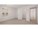 Bright bedroom with neutral carpet, large window and view to adjoining room at 604 Kimberwick Dr, Locust Grove, GA 30248