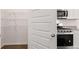 Kitchen appliances, shelving and hard wood floors at 604 Kimberwick Dr, Locust Grove, GA 30248