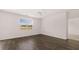 Bright living room featuring modern flooring, ceiling fan and lots of natural light at 604 Kimberwick Dr, Locust Grove, GA 30248