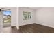 Bright living room featuring modern flooring and large window with natural light at 604 Kimberwick Dr, Locust Grove, GA 30248