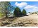Expansive backyard with lush trees and neighboring homes in the distance at 840 Franklin Mill Trce, Loganville, GA 30052
