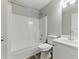 Bright bathroom featuring a tub with shower and a white single sink vanity at 840 Franklin Mill Trce, Loganville, GA 30052