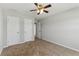 Bedroom with a ceiling fan, carpet flooring, and multiple closets at 840 Franklin Mill Trce, Loganville, GA 30052