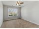 Bedroom with carpet, a window with natural light, and neutral paint at 840 Franklin Mill Trce, Loganville, GA 30052