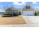Charming single-story home featuring a two-car garage and well-maintained landscaping at 840 Franklin Mill Trce, Loganville, GA 30052