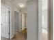 Bright hallway with white doors leading to different rooms at 840 Franklin Mill Trce, Loganville, GA 30052