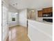 Kitchen and breakfast nook featuring hardwood floors, white trim, and stainless steel appliances at 840 Franklin Mill Trce, Loganville, GA 30052