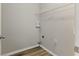 A small laundry room features new wooden-look floors and a wire shelf at 840 Franklin Mill Trce, Loganville, GA 30052