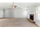 Bright living room with vaulted ceilings, a stone fireplace, and neutral color palette at 840 Franklin Mill Trce, Loganville, GA 30052