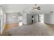 Open-concept living area showing the transition between carpet and hardwood flooring at 840 Franklin Mill Trce, Loganville, GA 30052
